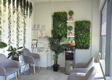 Inviting waiting area at Mc Nails with green decor, Gibbons, Alberta, CA.