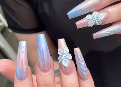 Elegant pastel nails with floral designs at Mc Nails, Gibbons, Alberta, CA offering exquisite nail artistry.