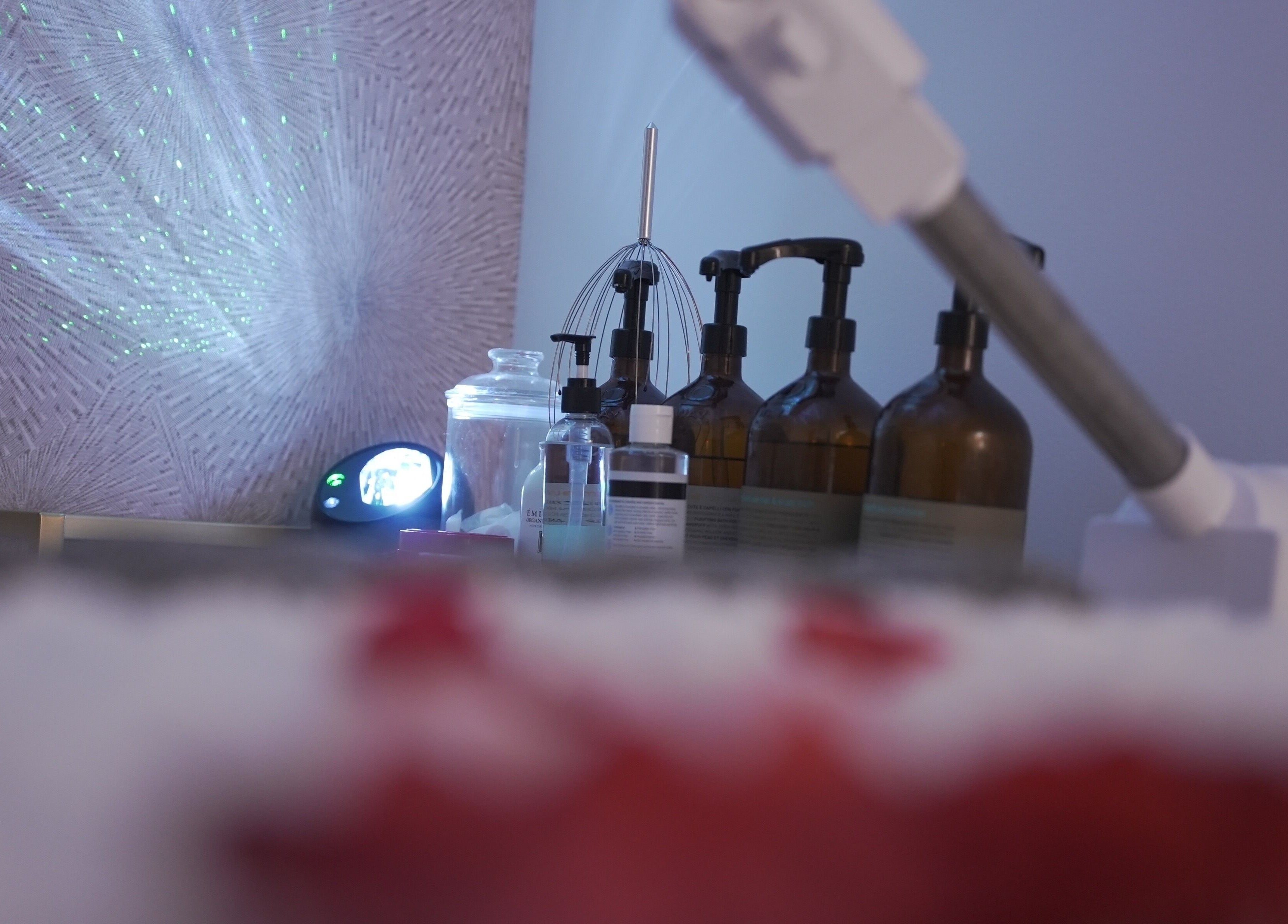 Relaxing spa setup at Lavie Bella Head Spa in Artesia, California, featuring essential oils and ambient lighting.