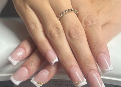 Beautiful French manicure with gold accents at Nailed.bymais, Grays, England, GB.