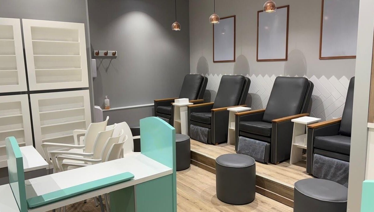 Comfortable pedicure chairs at KG Lushious Hair Nails Salon in Sandton, Gauteng, ZA. Modern and inviting setup.