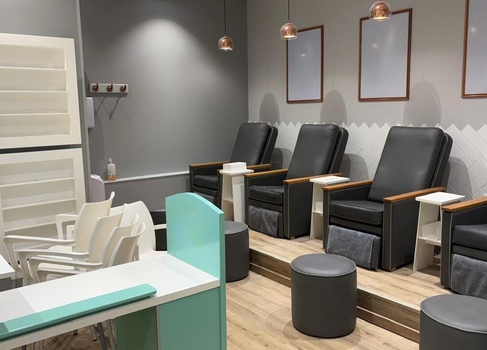 Comfortable pedicure chairs at KG Lushious Hair Nails Salon in Sandton, Gauteng, ZA. Modern and inviting setup.
