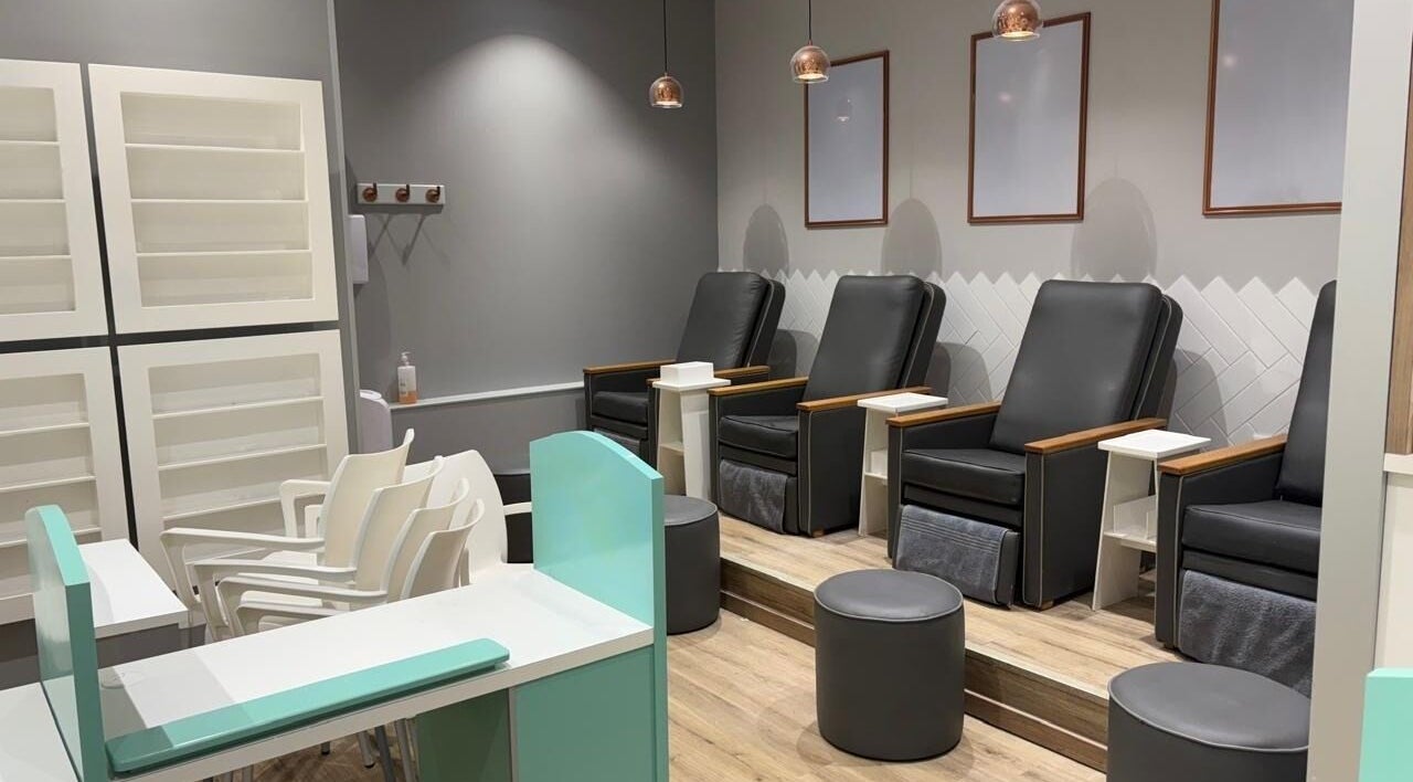 Comfortable pedicure chairs at KG Lushious Hair Nails Salon in Sandton, Gauteng, ZA. Modern and inviting setup.