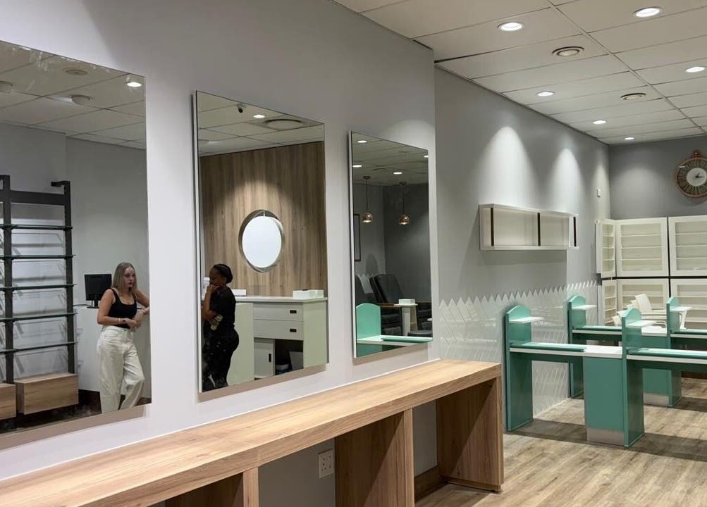 Elegant, modern interior of KG Lushious Hair Nails Salon in Sandton, Gauteng, ZA showcasing sleek design.