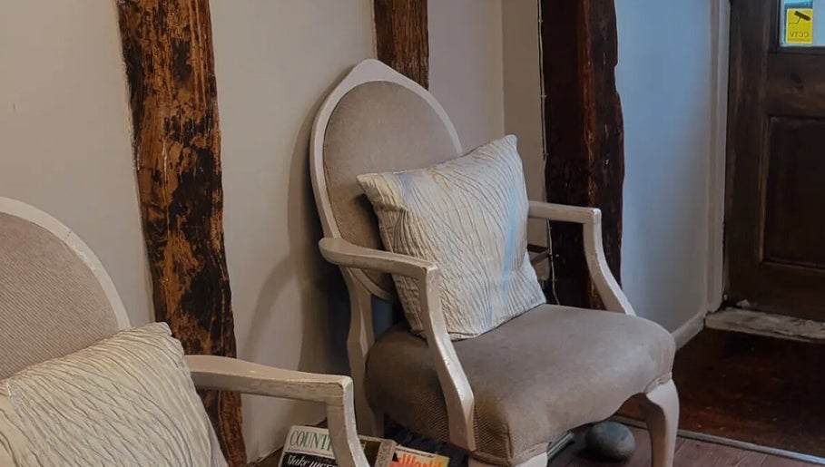 Comfy seating in rustic decor at The Cutting Co., Woodbridge, England, GB.