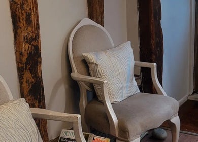 Comfy seating in rustic decor at The Cutting Co., Woodbridge, England, GB.