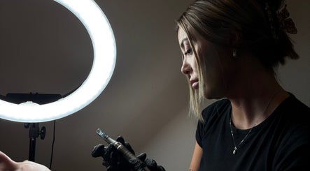 Luxury Beauty By Liv's expert in Louth, England performing detailed beauty treatment under bright ring light.