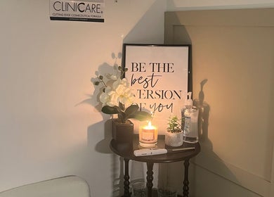 Relaxing corner at Luxury Beauty By Liv, Louth, England, with a candle, flowers, and an inspiring quote.