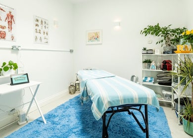 Brighton Massage therapy room in Brighton And Hove, England, GB with a cozy massage bed and relaxing decor.