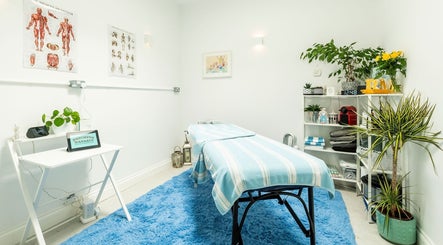 Brighton Massage therapy room in Brighton And Hove, England, GB with a cozy massage bed and relaxing decor.