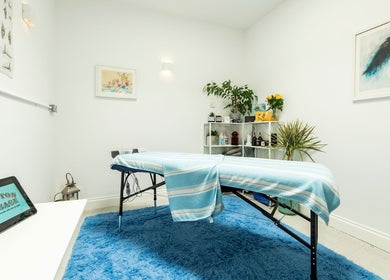 Brighton Massage room in Brighton And Hove, England features a serene setup with a massage table and soothing decor.
