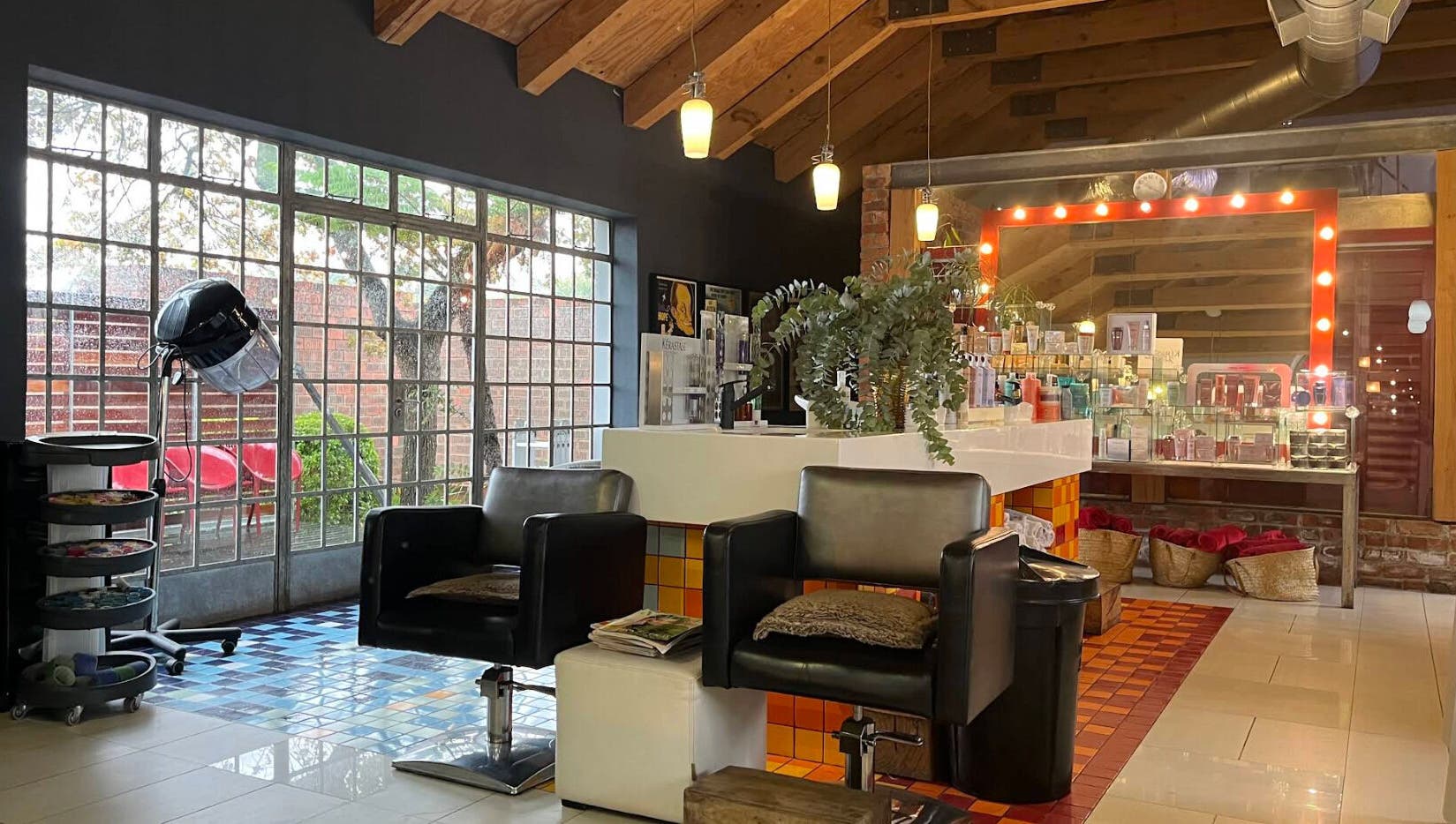 Kymric Hall beauty salon interior, featuring modern chairs and products, Franschhoek, Western Cape, ZA.