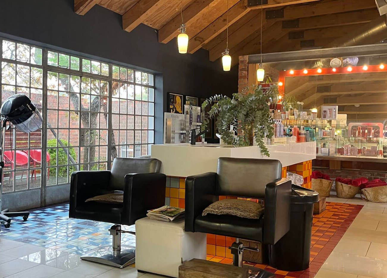 Kymric Hall beauty salon interior, featuring modern chairs and products, Franschhoek, Western Cape, ZA.