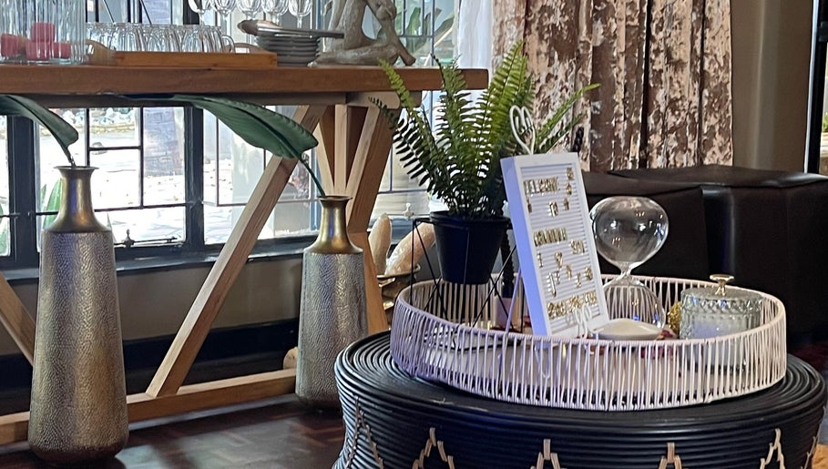 Stylish interior decor at Konanani Massage & Spa, Polokwane, Limpopo, ZA, with vases and greenery.