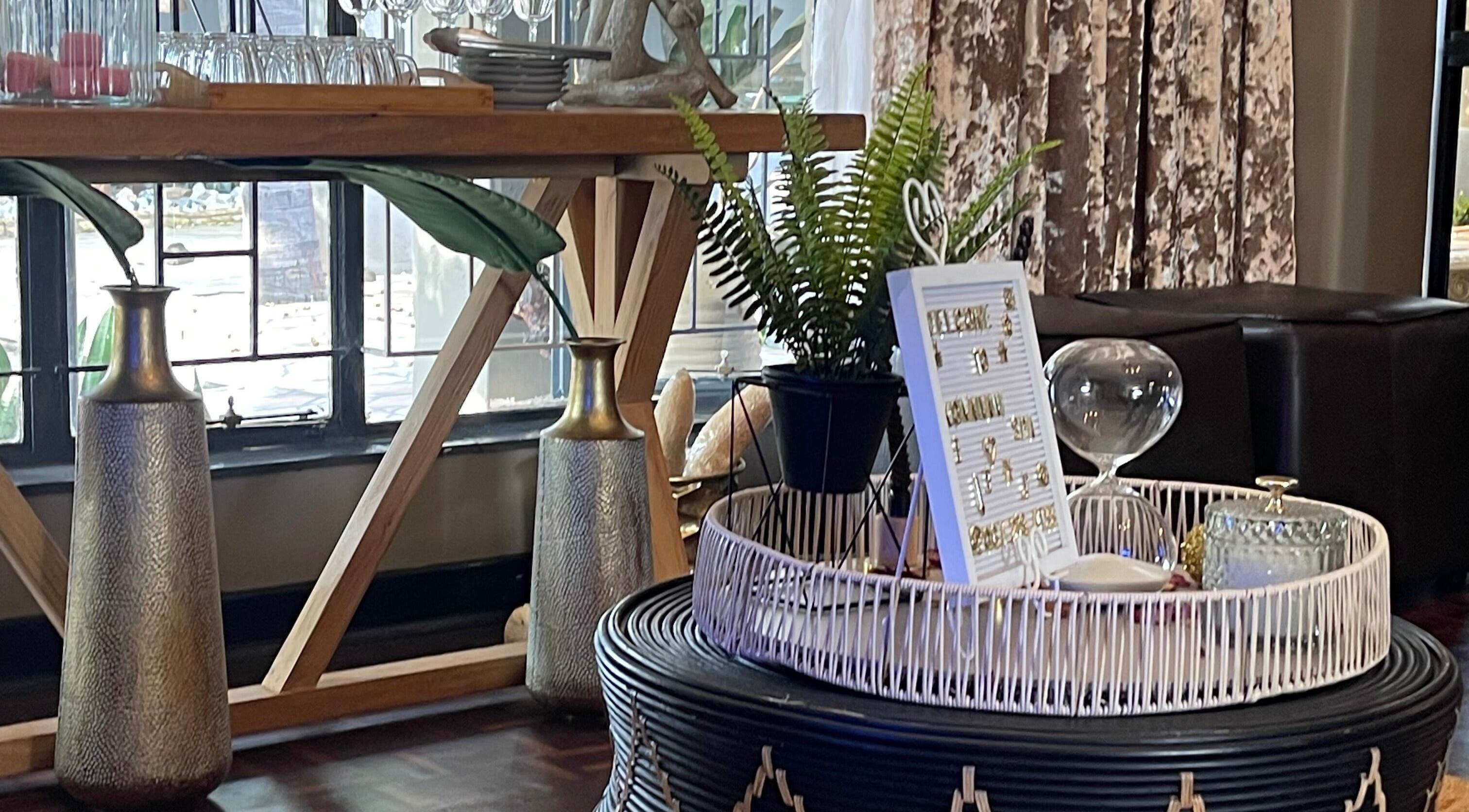 Stylish interior decor at Konanani Massage & Spa, Polokwane, Limpopo, ZA, with vases and greenery.