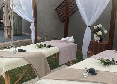 Outdoor massage setup at Konanani Massage & Spa, Polokwane, Limpopo, ZA with elegant drapes and flowers.