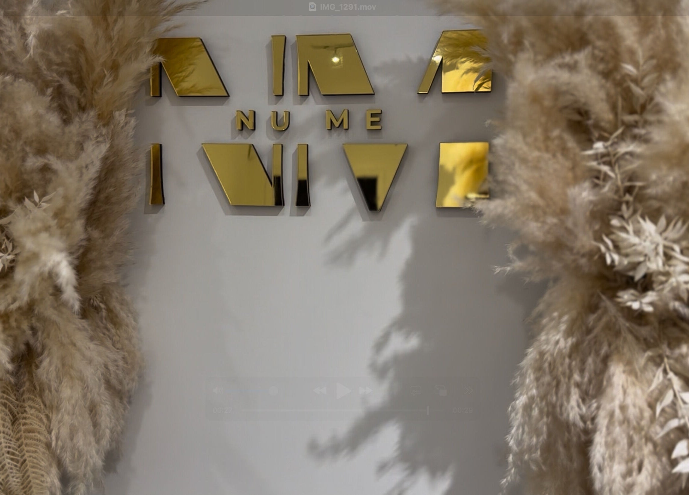Elegant golden sign with pampas grass décor at Form Therapy, Grays, England, GB.