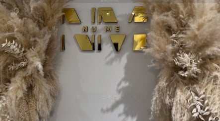 Elegant golden sign with pampas grass décor at Form Therapy, Grays, England, GB.