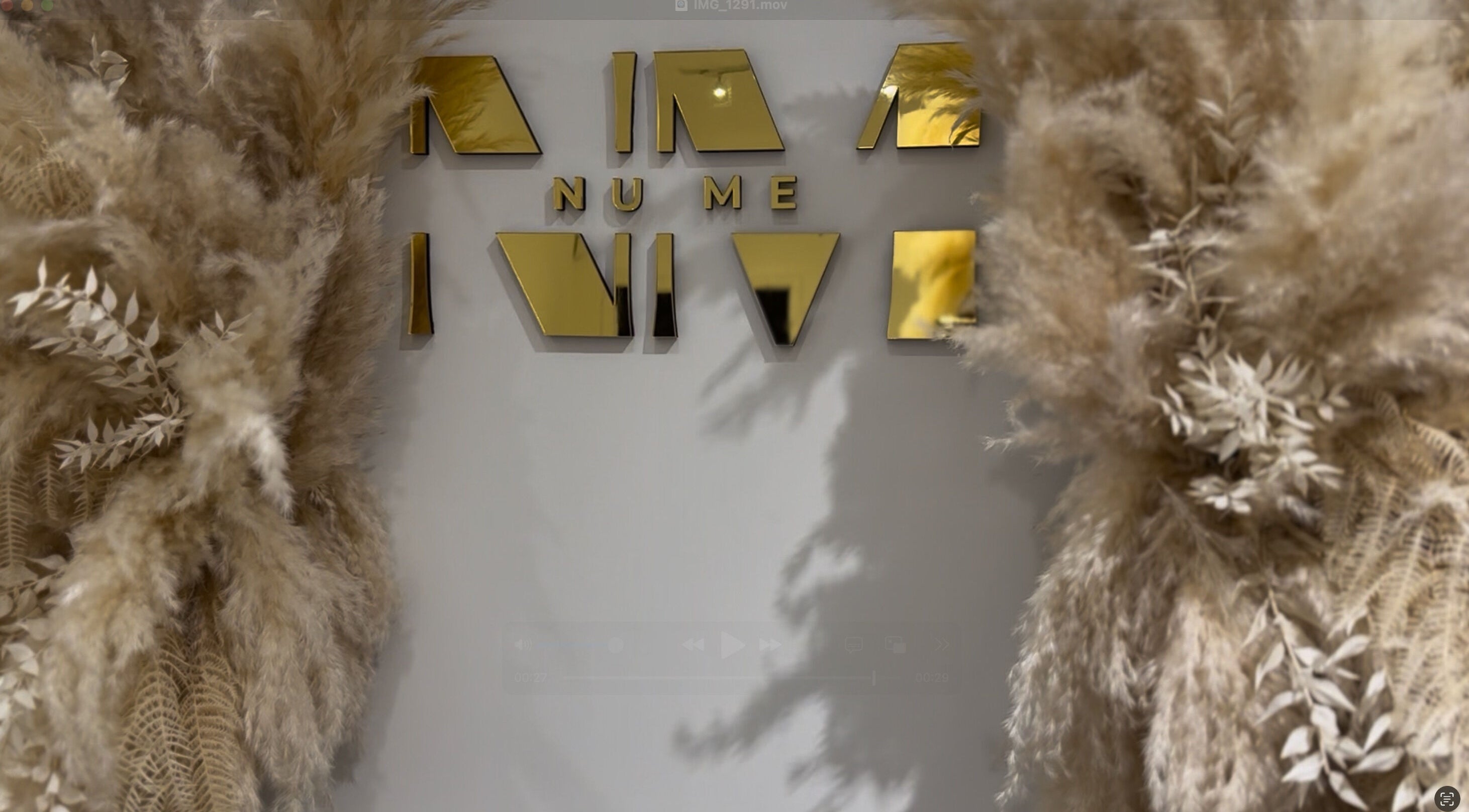 Elegant golden sign with pampas grass décor at Form Therapy, Grays, England, GB.