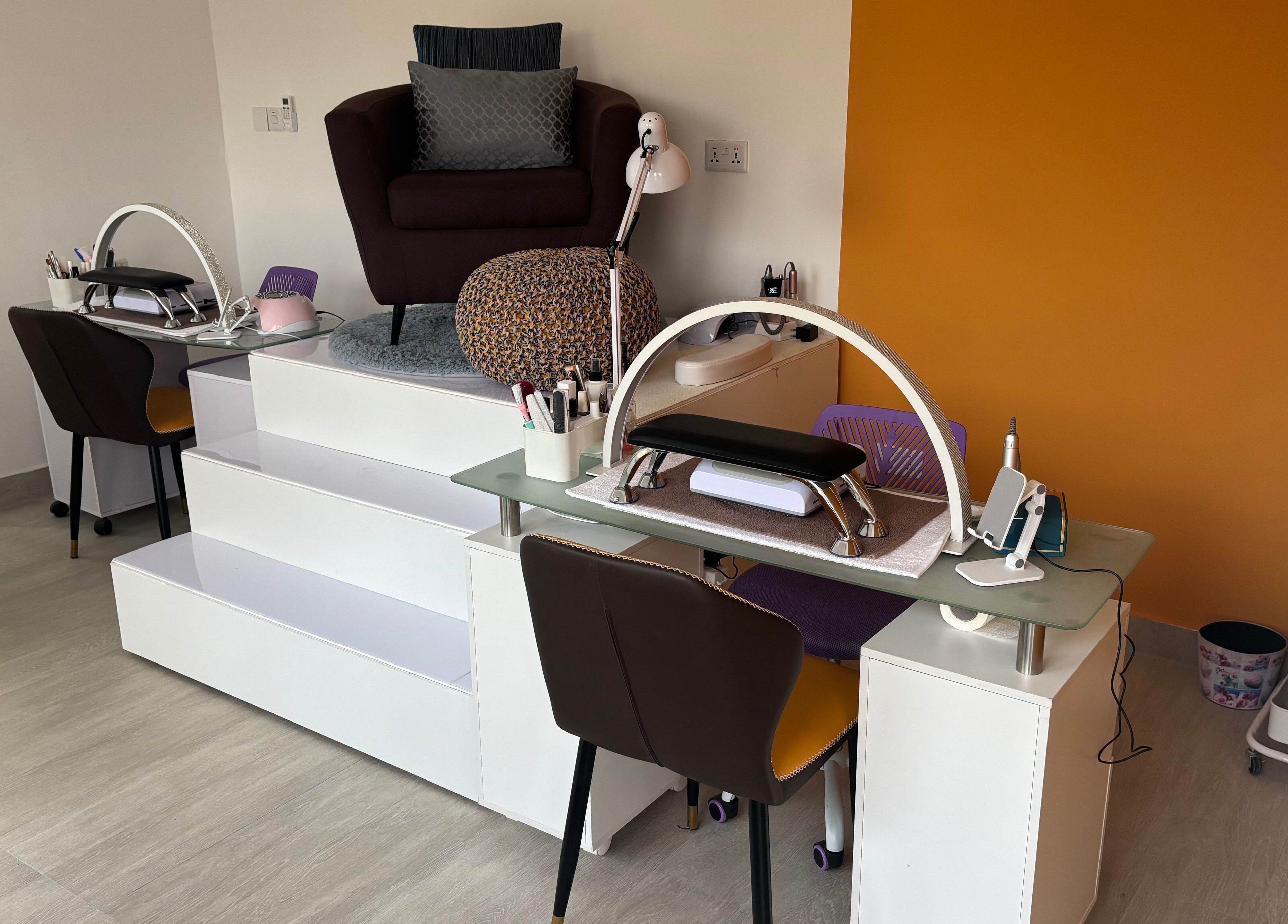 Nail care station at Body Language, Accra, Greater Accra Region, GH, featuring modern seating and tools.