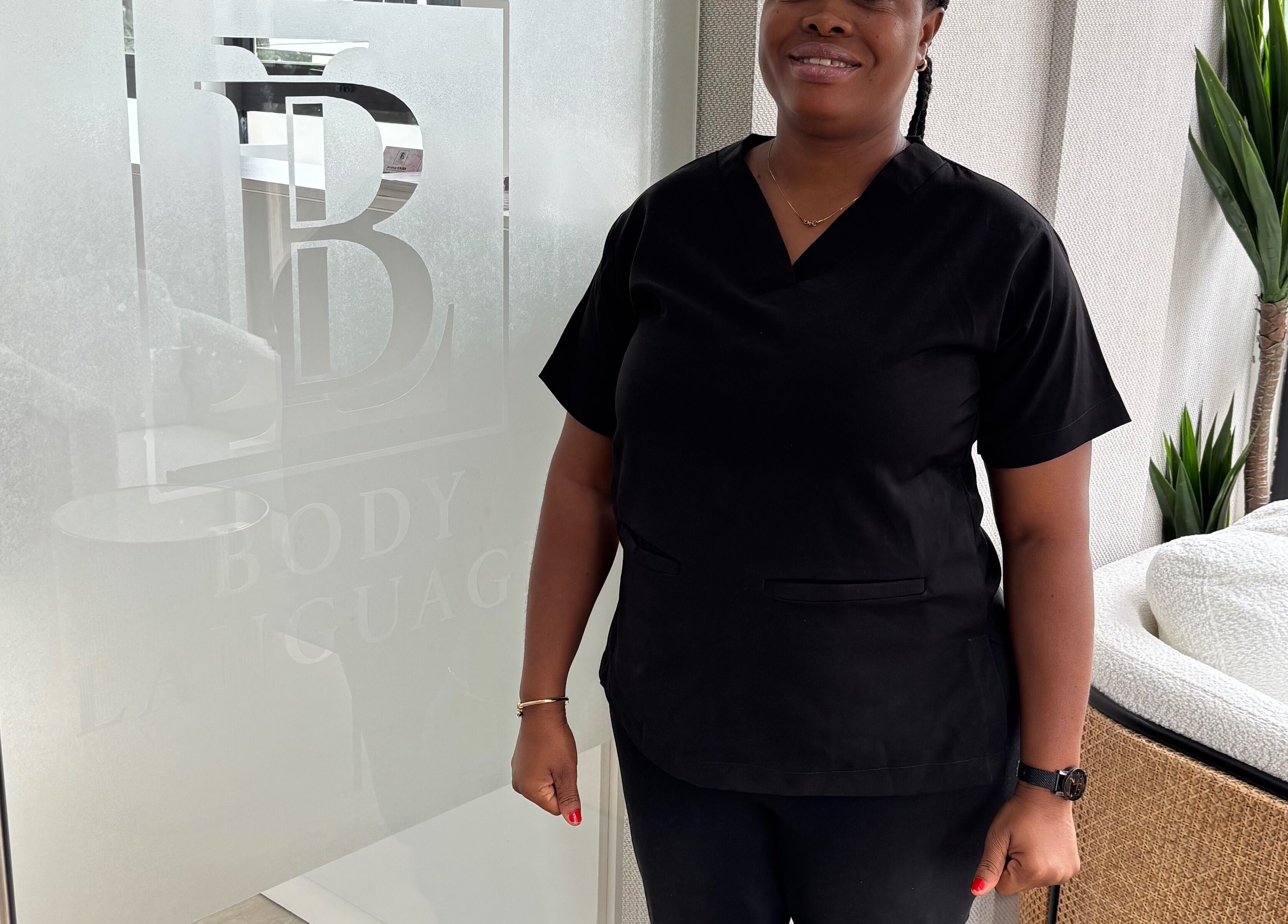 Professional greets visitors at Body Language, Accra, Greater Accra Region, GH.