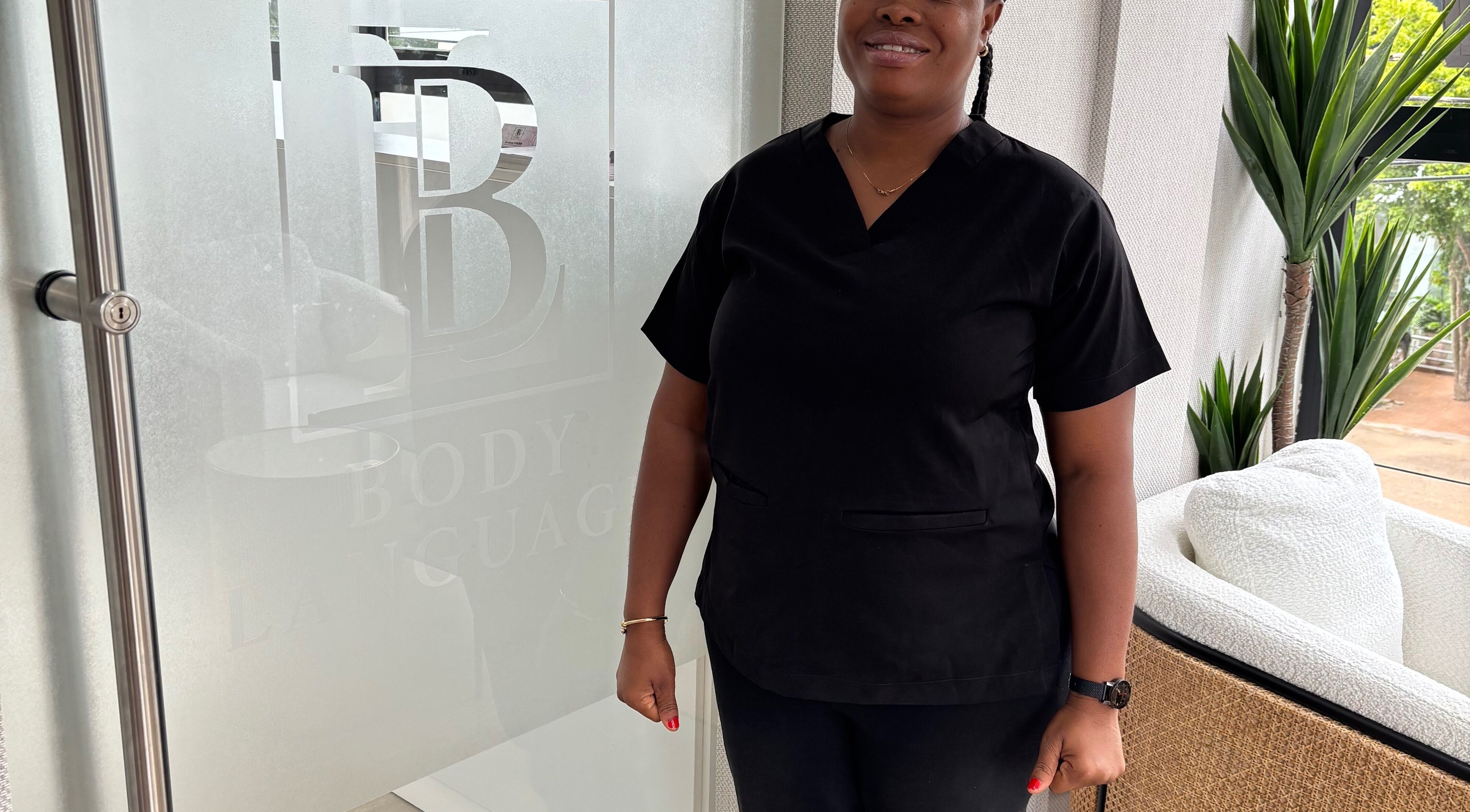 Professional greets visitors at Body Language, Accra, Greater Accra Region, GH.