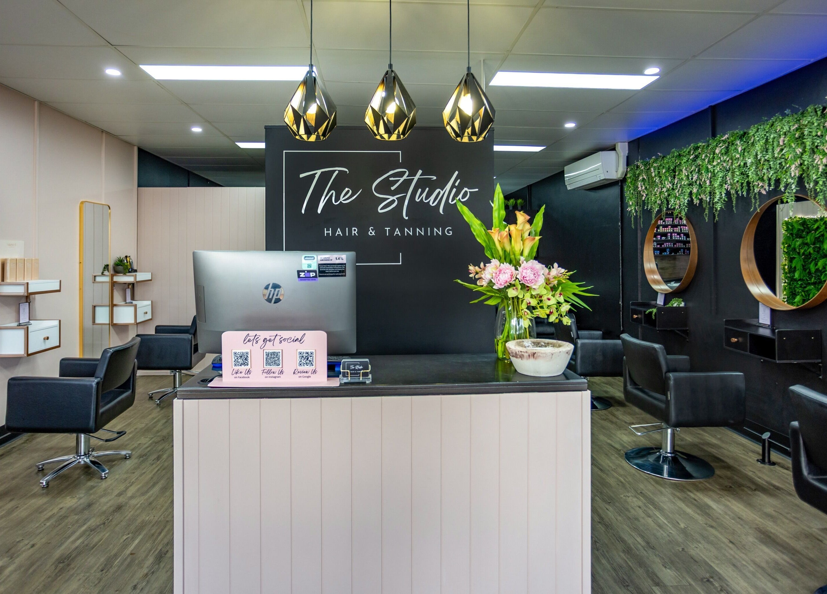 Chic interior of The Studio Hair & Tanning in Deception Bay, Queensland, AU with stylish chairs and decor.