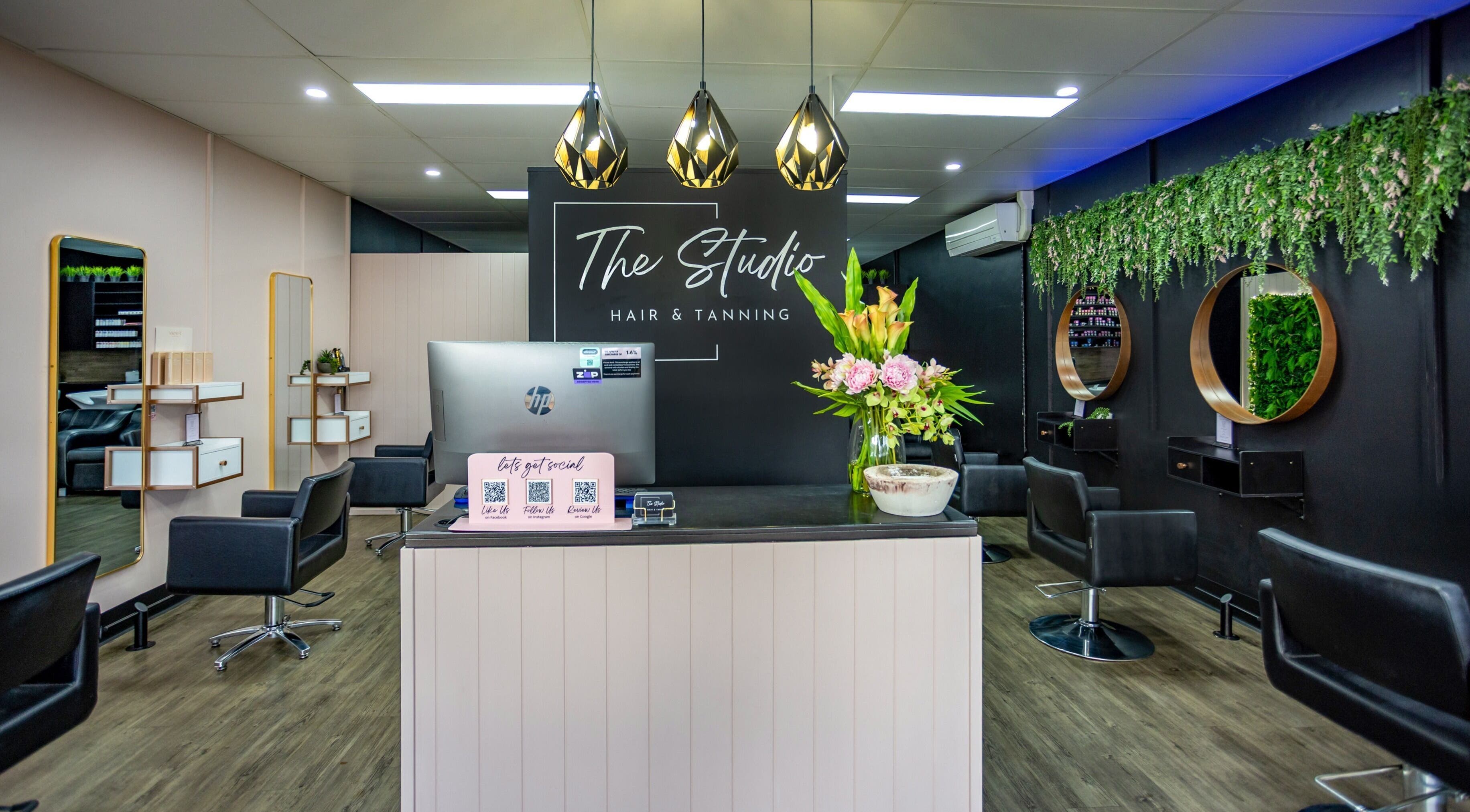 Chic interior of The Studio Hair & Tanning in Deception Bay, Queensland, AU with stylish chairs and decor.