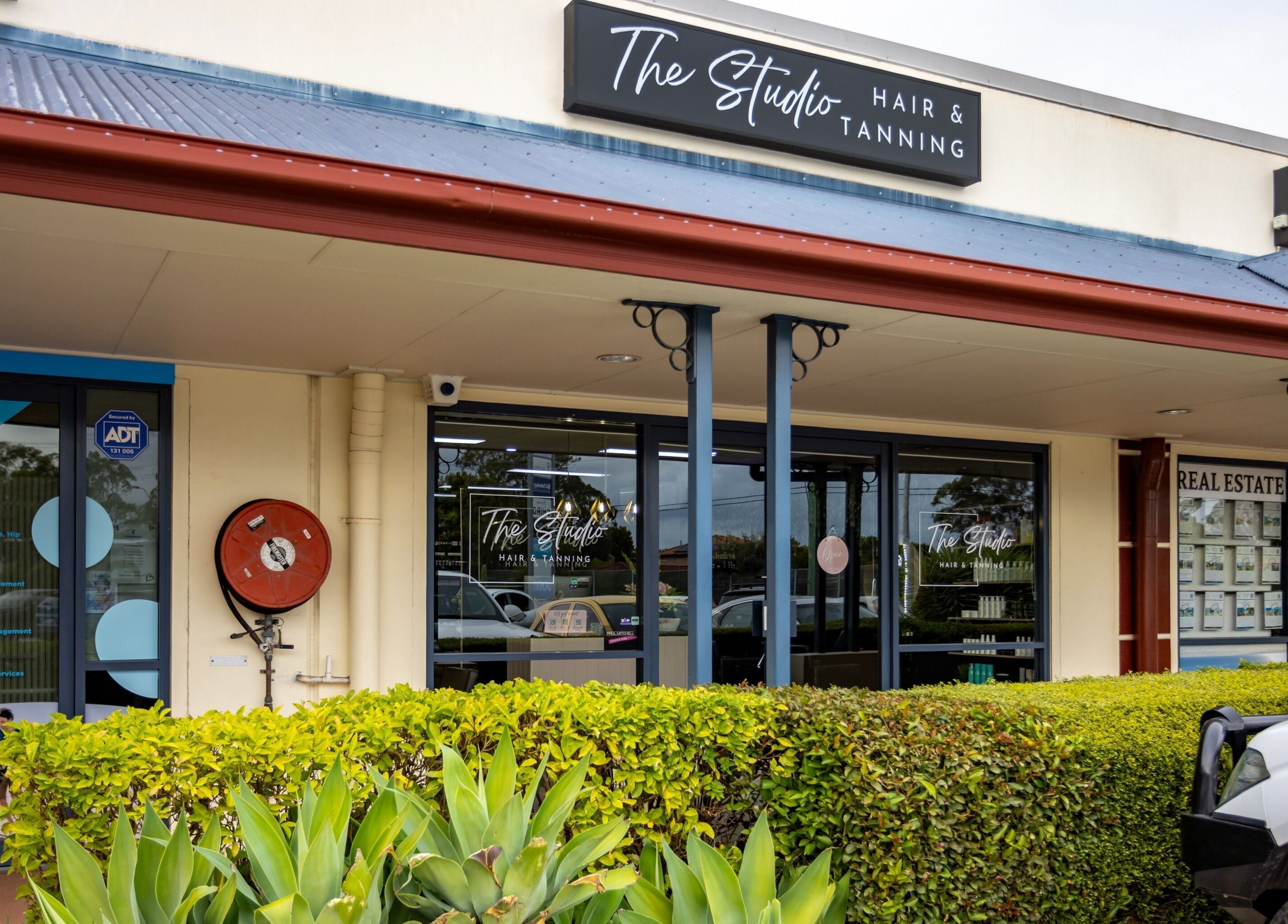 Exterior of The Studio Hair & Tanning in Deception Bay, Queensland, AU showcasing a modern facade.