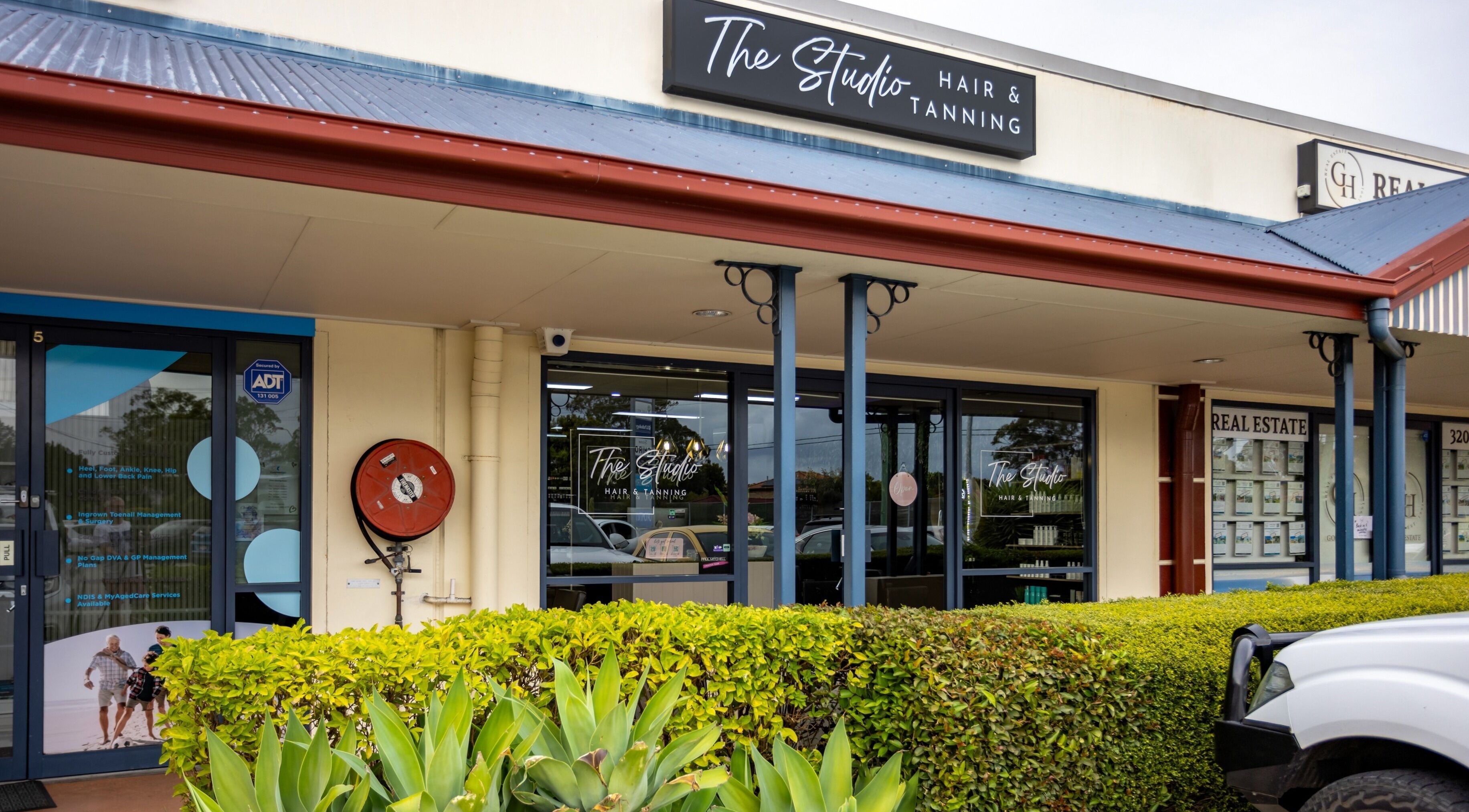 Exterior of The Studio Hair & Tanning in Deception Bay, Queensland, AU showcasing a modern facade.