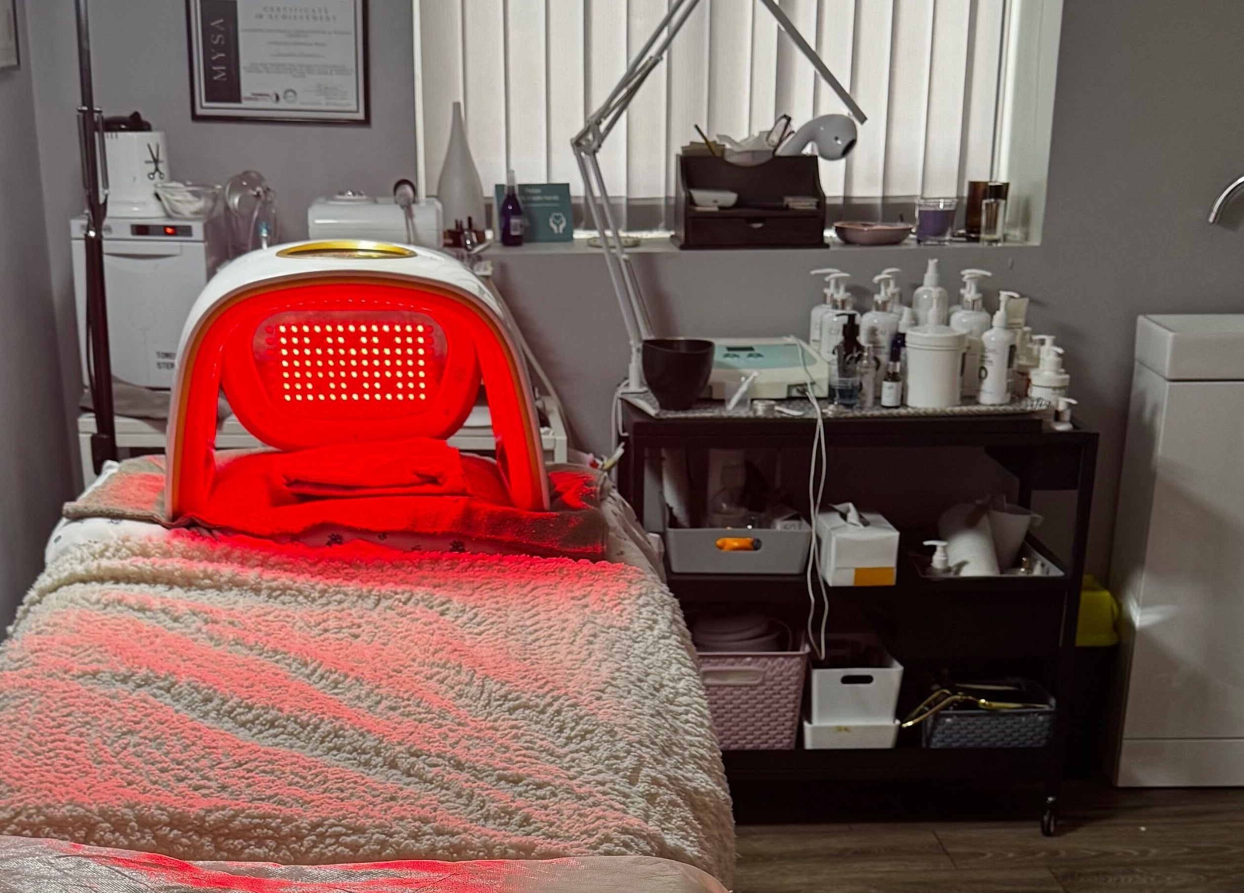 Red light therapy room at Confidence Beauty in Peterborough, England, GB, featuring a relaxing treatment bed.