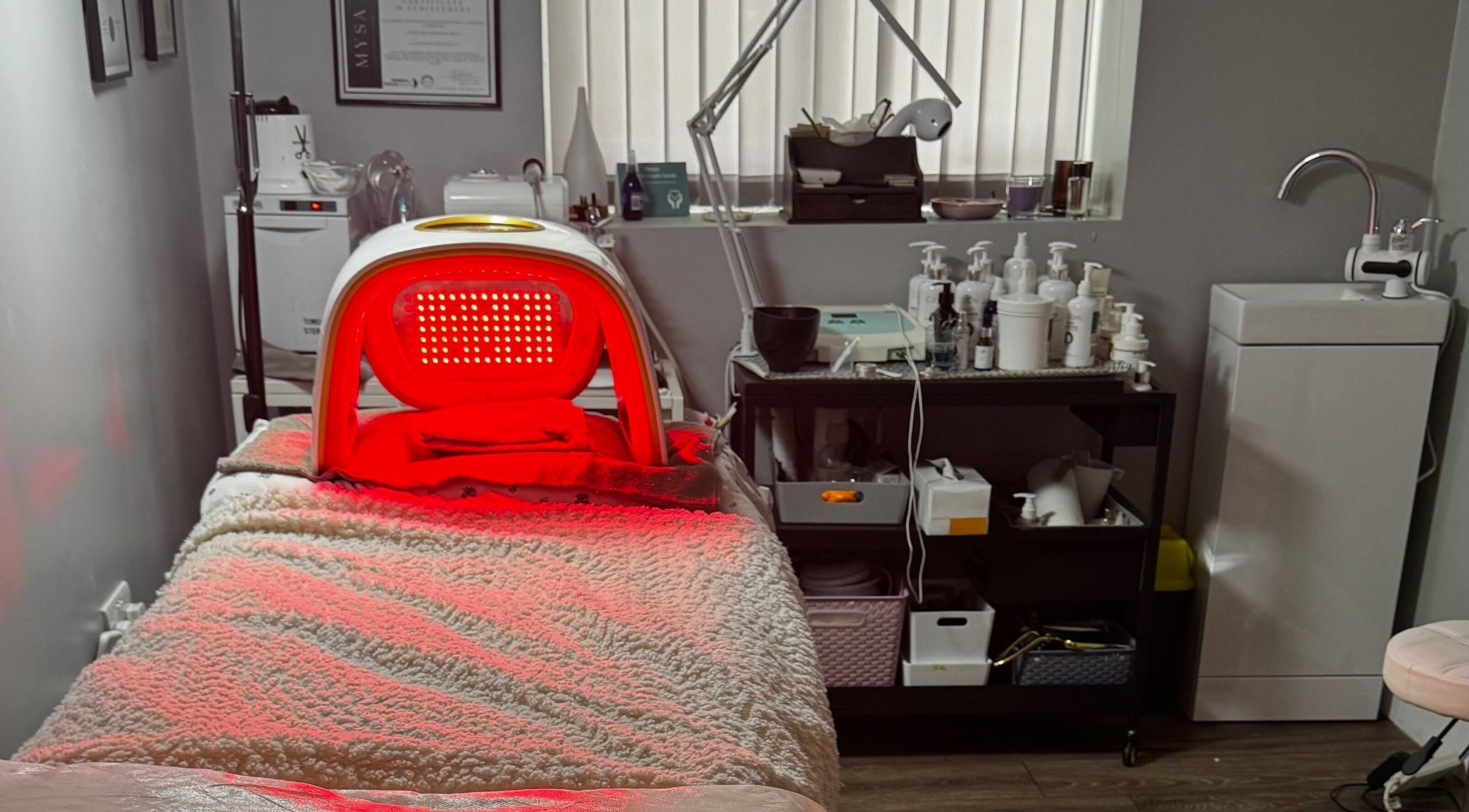 Red light therapy room at Confidence Beauty in Peterborough, England, GB, featuring a relaxing treatment bed.