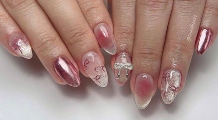 Elegant nail art design at Pro Nails Salon in Winnipeg, Manitoba, CA featuring shimmering pinks and intricate patterns.