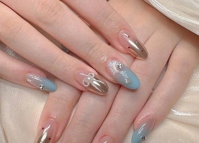Elegant nail art with blue and gold design at Pro Nails Salon in Winnipeg, Manitoba, CA.