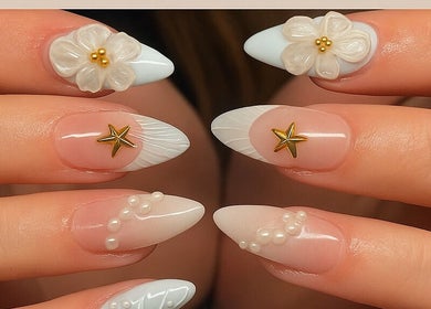 Elegant floral nail art with stars at Pro Nails Salon, Winnipeg, Manitoba, CA, showcasing intricate design.