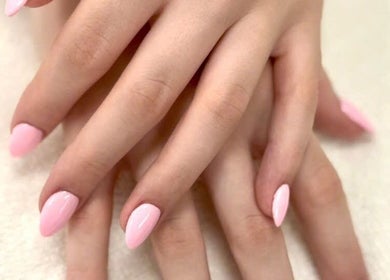 Soft pink manicured nails at Pro Nails Salon located in Winnipeg, Manitoba, CA.