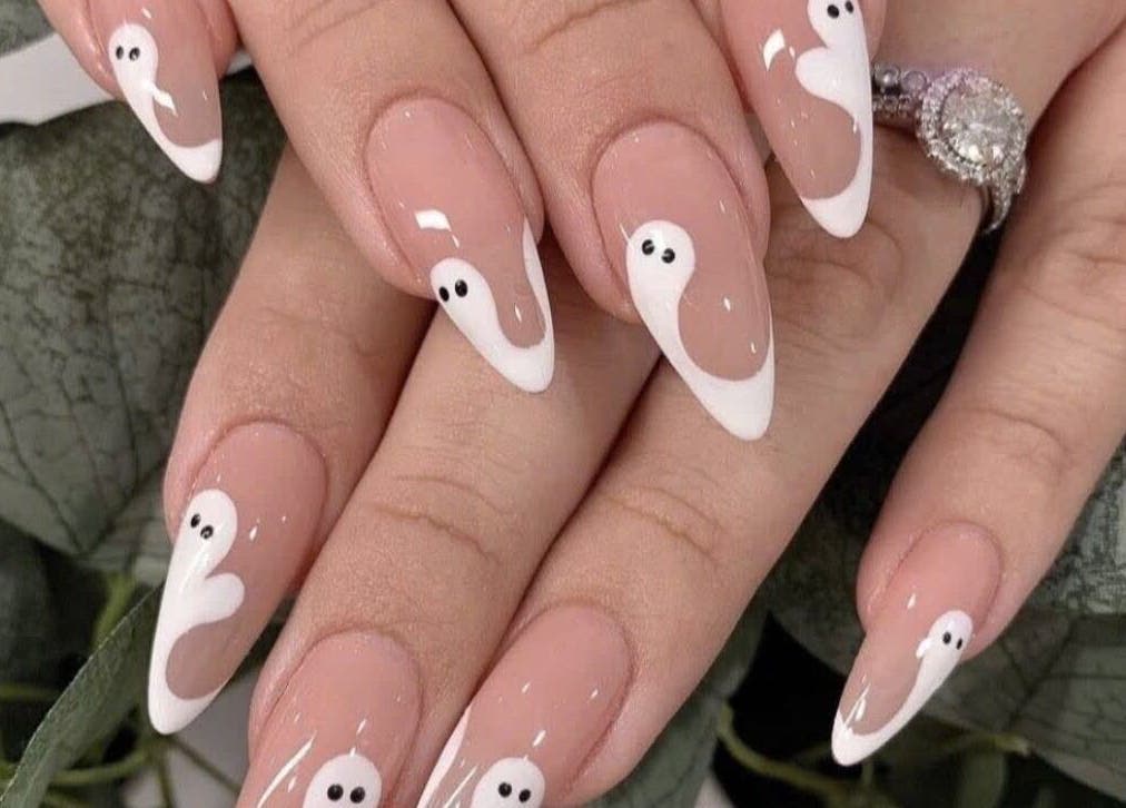 Chic ghost nail art at Pro Nails Salon, Winnipeg, Manitoba, CA. Perfect for a unique, stylish look.