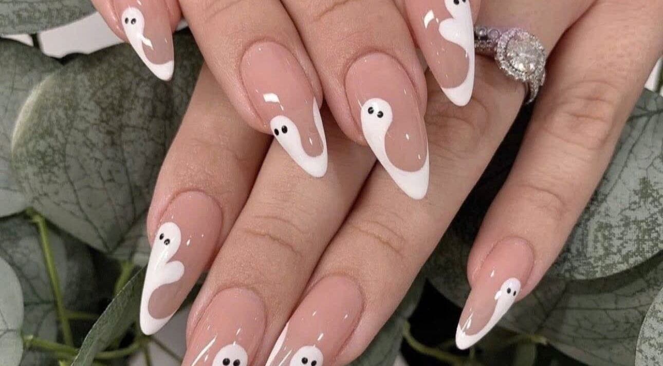 Chic ghost nail art at Pro Nails Salon, Winnipeg, Manitoba, CA. Perfect for a unique, stylish look.