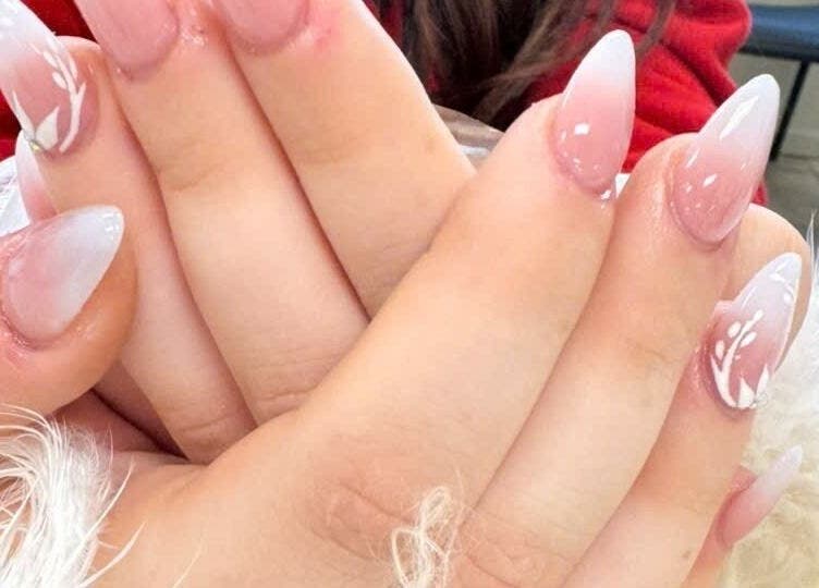 Stylish nail art with pink and white design at Pro Nails Salon, Winnipeg, Manitoba, CA.