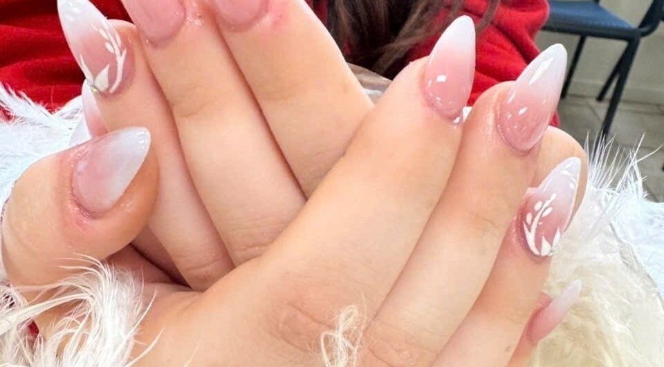 Stylish nail art with pink and white design at Pro Nails Salon, Winnipeg, Manitoba, CA.