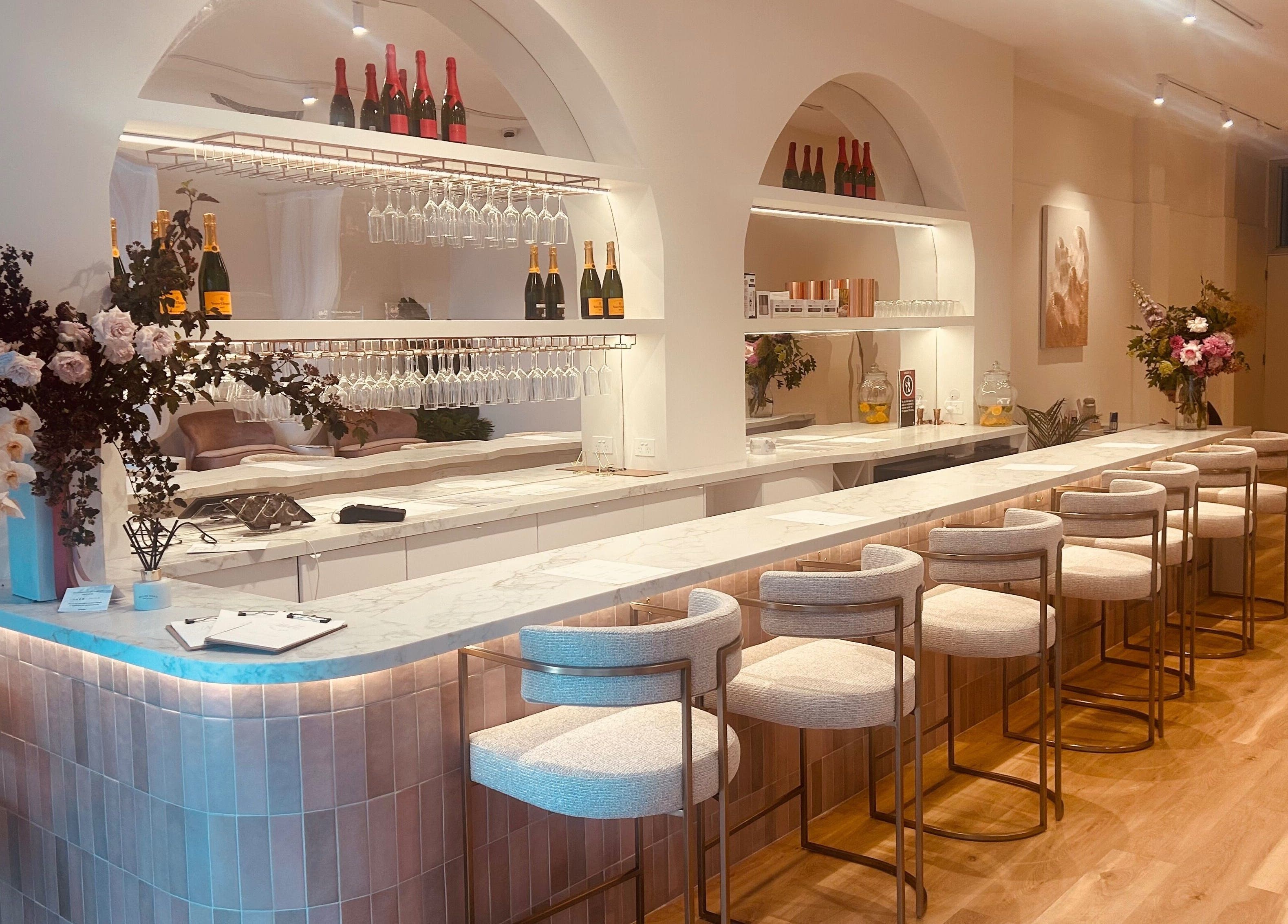 Elegant interior of Melt Nail Bar in Bronte, New South Wales, AU featuring a chic counter and stylish seating.