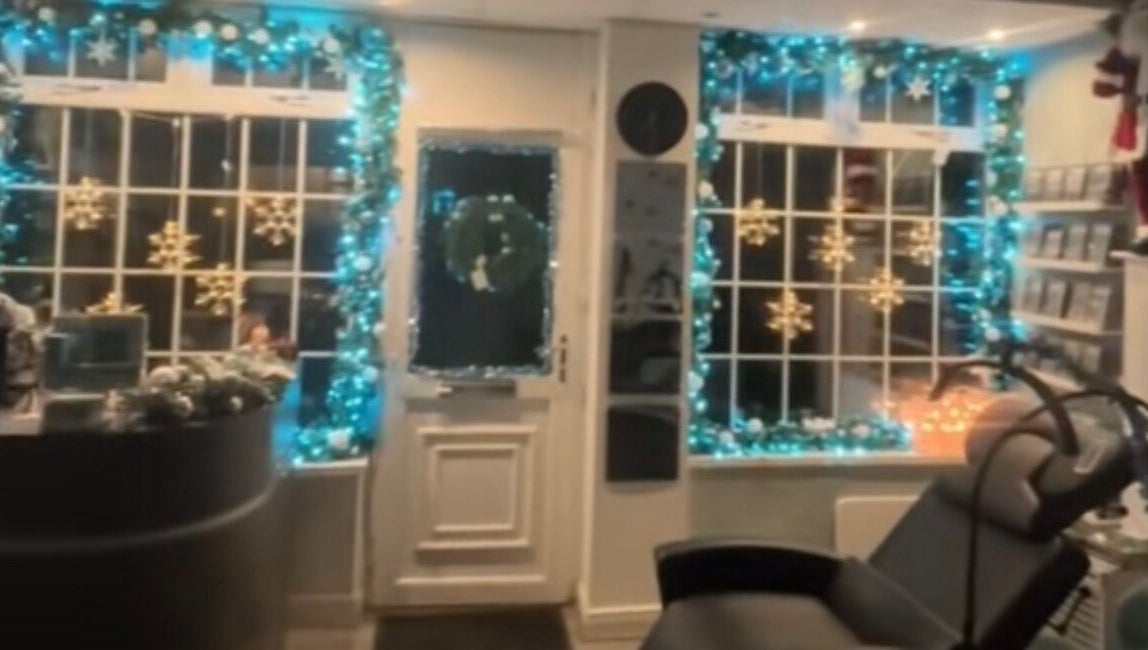 Festively decorated entrance of The Lash Studio NE in Jarrow, England, GB with holiday lights and snowflake motifs.