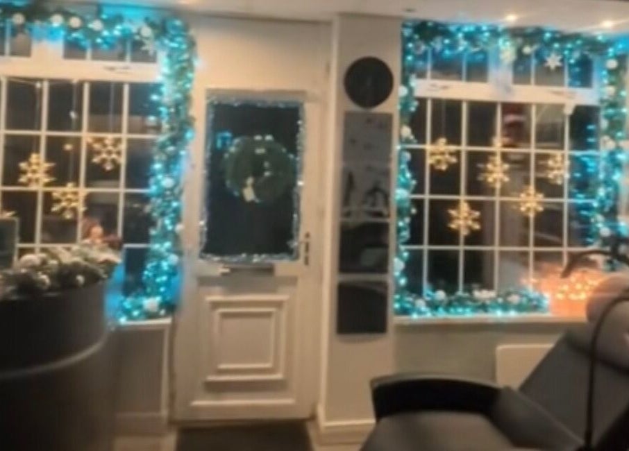Festively decorated entrance of The Lash Studio NE in Jarrow, England, GB with holiday lights and snowflake motifs.
