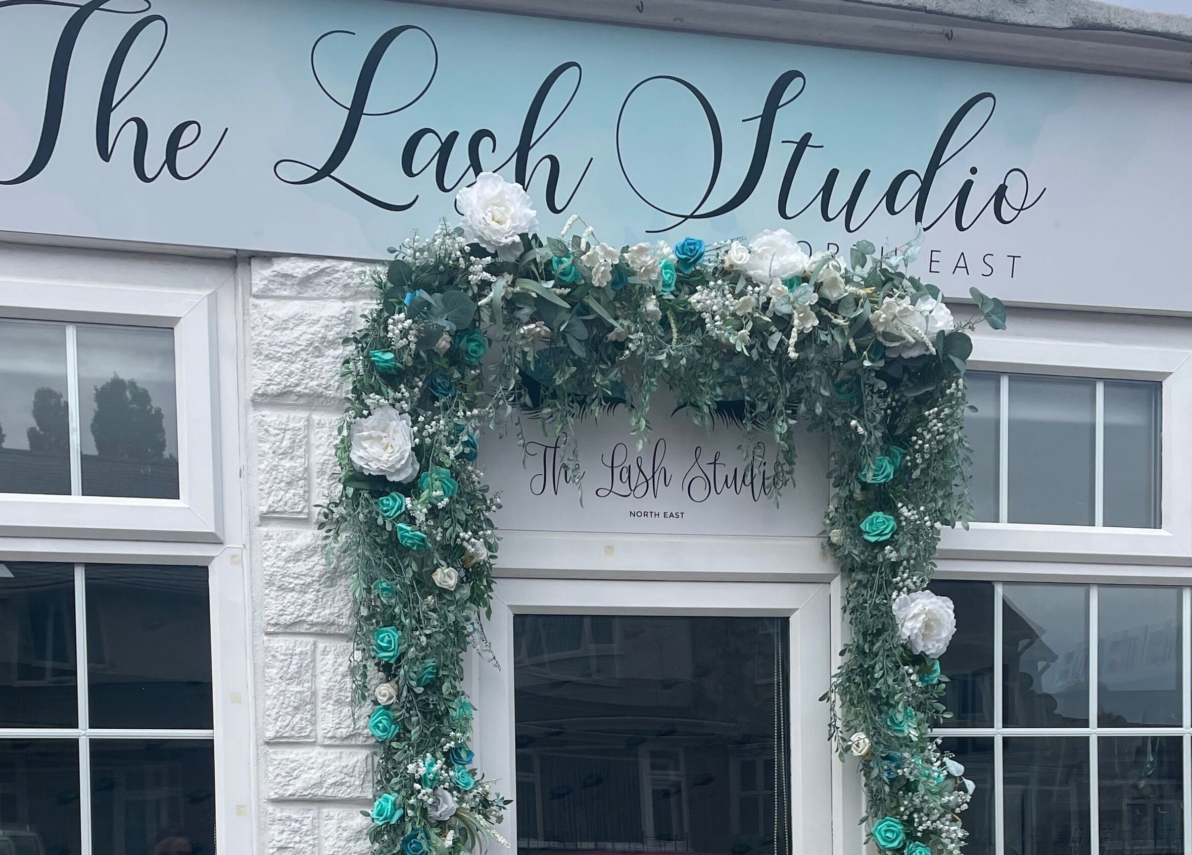 Charming floral-adorned entrance of The Lash Studio NE in Jarrow, England, GB.