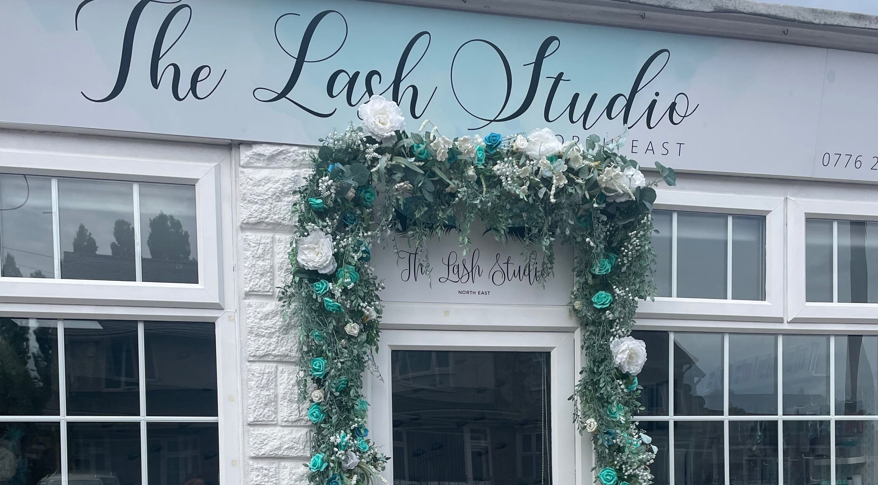 Charming floral-adorned entrance of The Lash Studio NE in Jarrow, England, GB.