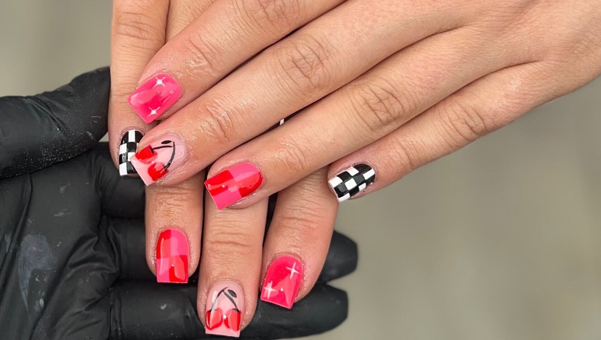 Stylish cherry and checkered nail art at Nails by jodie-lea, Eccles, England, GB.