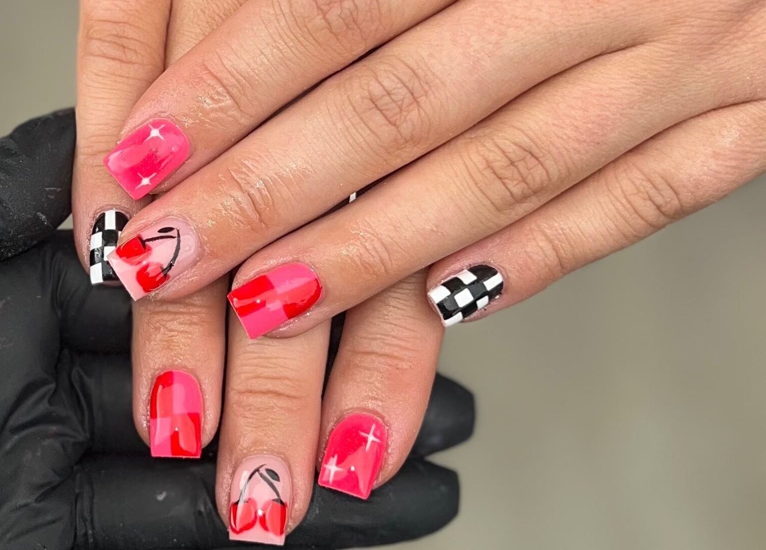 Stylish cherry and checkered nail art at Nails by jodie-lea, Eccles, England, GB.