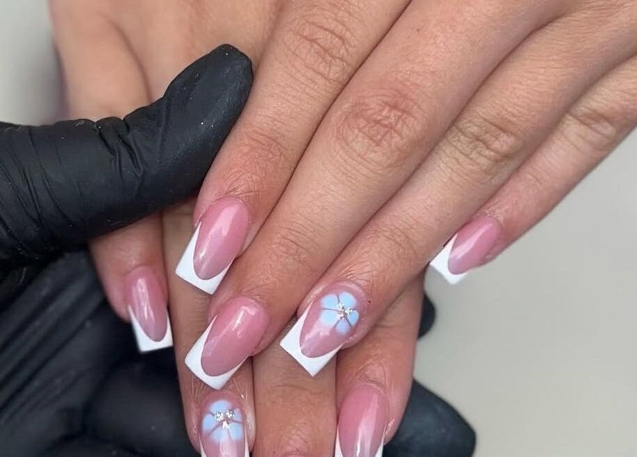 Elegant floral nail art at Nails by jodie-lea, Eccles, England, GB, showcasing pink nails with white tips.