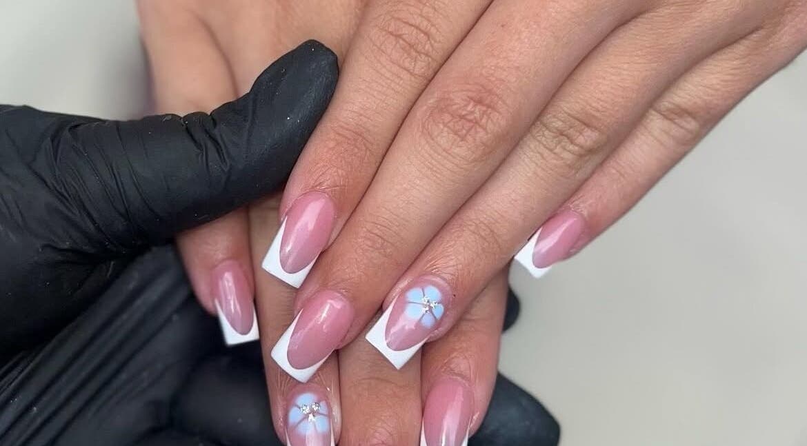 Elegant floral nail art at Nails by jodie-lea, Eccles, England, GB, showcasing pink nails with white tips.