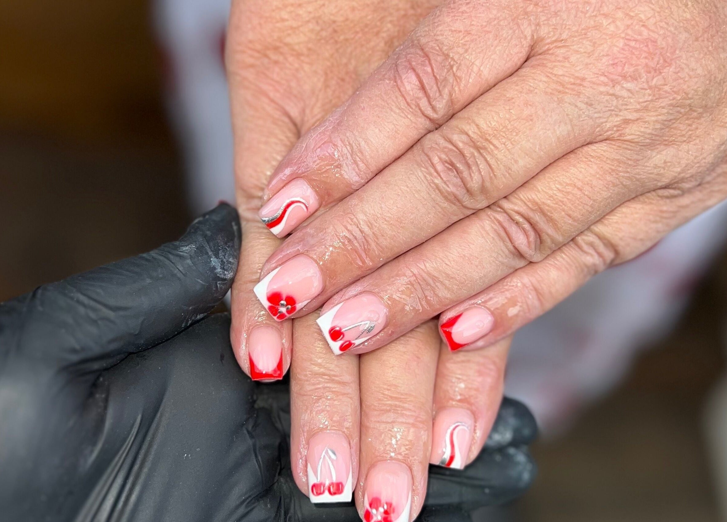 Red and white floral nail art at Nails by jodie-lea, Eccles, England, GB.